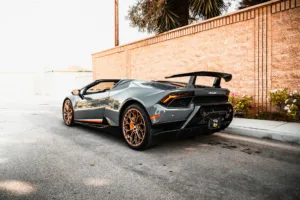 gray lamborghini parked on the road